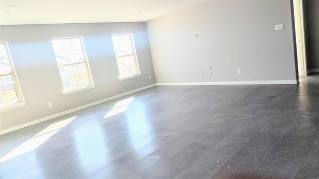 spare room with plenty of natural light