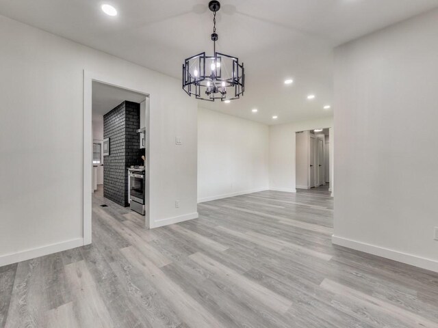 interior space featuring light hardwood / wood-style flooring and a notable chandelier