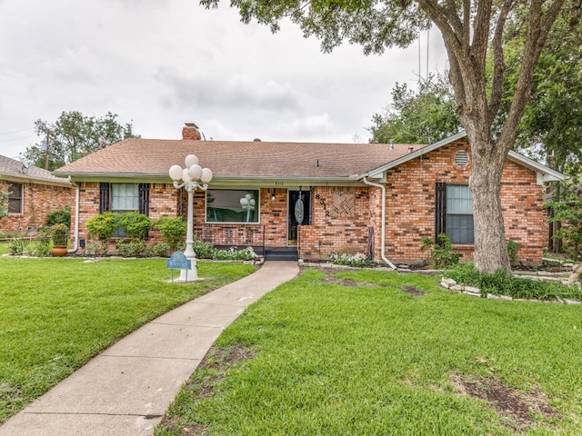 ranch-style home featuring a front yard