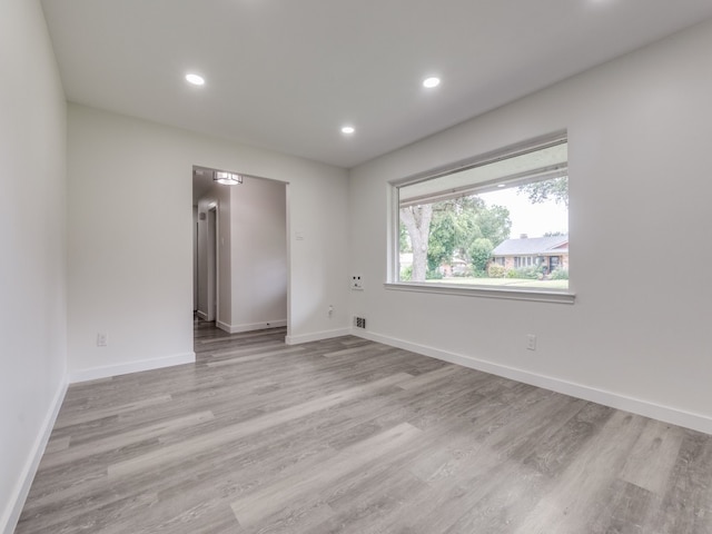 empty room with light wood-type flooring