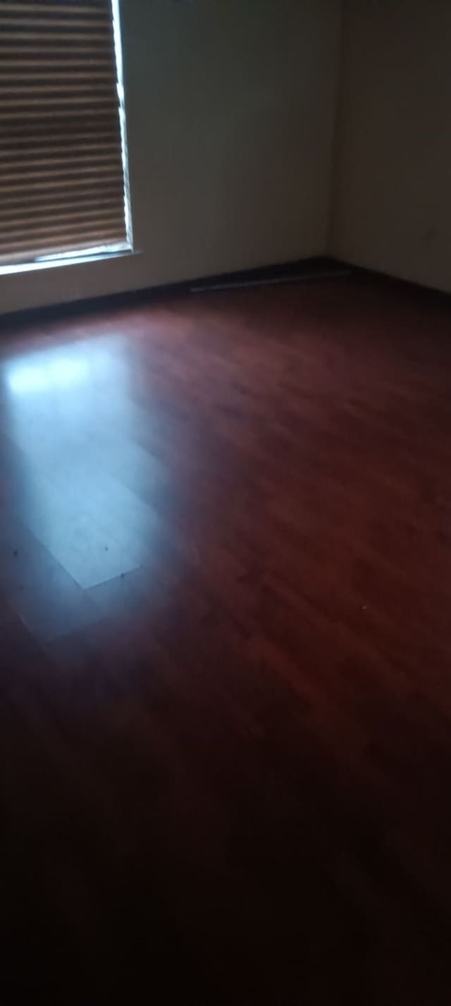 unfurnished room featuring hardwood / wood-style floors