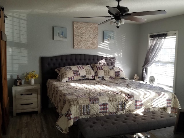 bedroom with dark wood-type flooring and ceiling fan