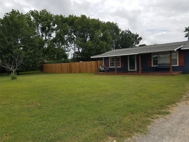 view of yard with covered porch