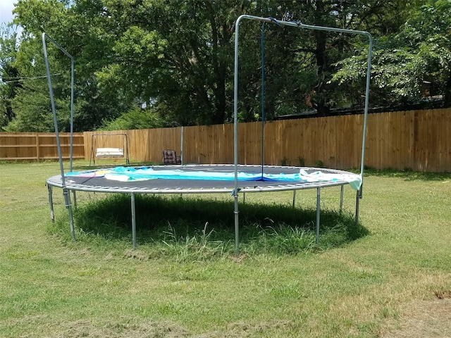 view of swimming pool featuring a lawn