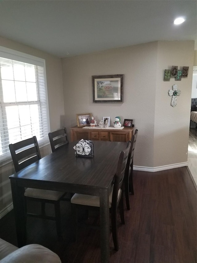 dining room with dark wood-type flooring