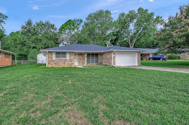 ranch-style home featuring a garage and a front yard