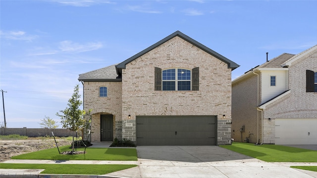 french provincial home featuring a front yard, brick siding, driveway, and an attached garage