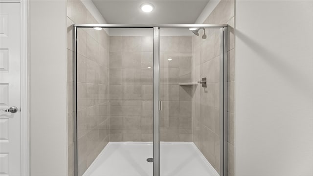 full bathroom featuring a stall shower