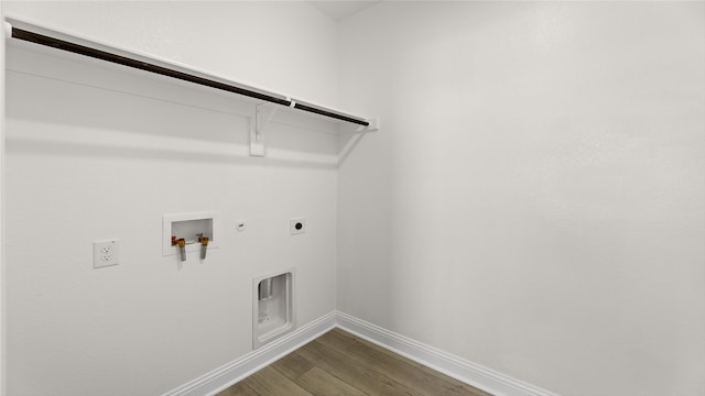 laundry area featuring dark wood-style flooring, electric dryer hookup, gas dryer hookup, laundry area, and hookup for a washing machine