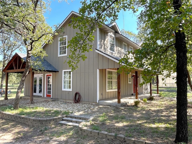 view of front of house with a patio and french doors