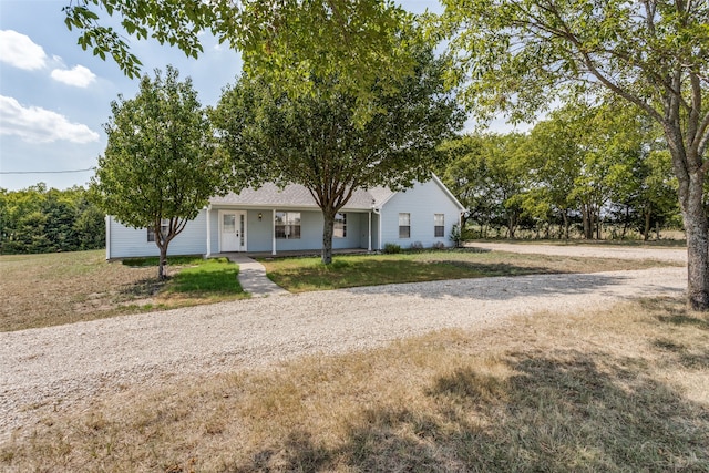 view of front of property with a porch and a front yard