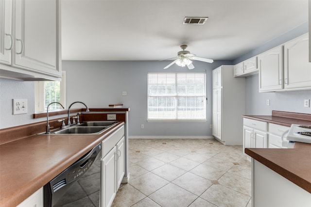 kitchen featuring black dishwasher, white cabinets, ceiling fan, sink, and light tile patterned flooring