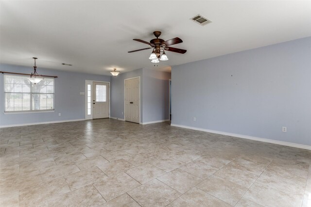 interior space featuring light tile patterned flooring and ceiling fan