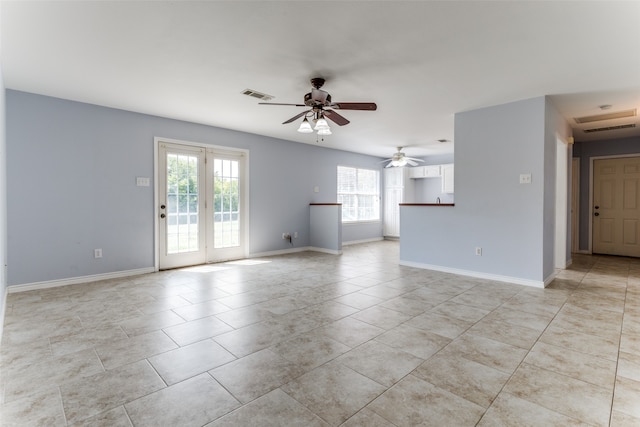 unfurnished room featuring ceiling fan and light tile patterned floors