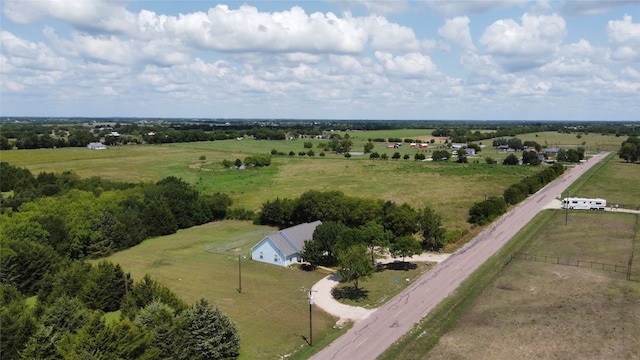 birds eye view of property with a rural view