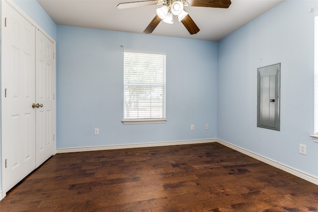 unfurnished bedroom with ceiling fan, hardwood / wood-style flooring, and electric panel