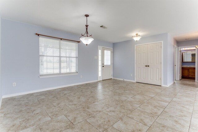 empty room with light tile patterned flooring