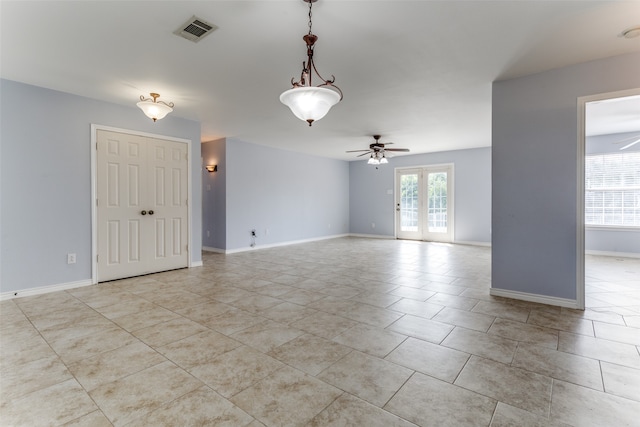 tiled empty room with ceiling fan