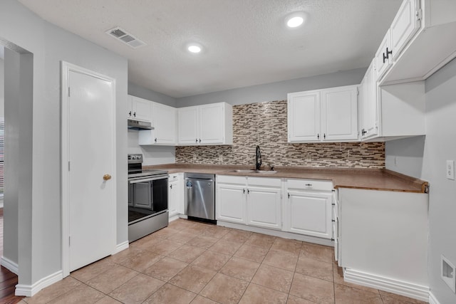 kitchen with white cabinetry, stainless steel dishwasher, electric stove, and light tile patterned flooring