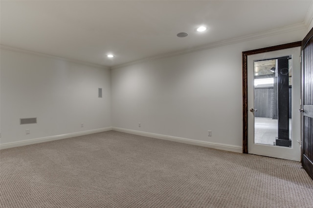 carpeted empty room featuring ornamental molding