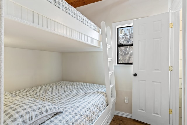 bedroom with hardwood / wood-style flooring