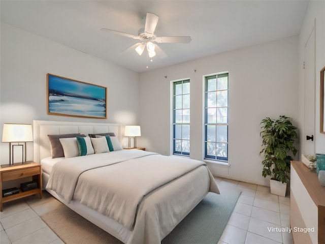 bedroom with light tile patterned floors and ceiling fan