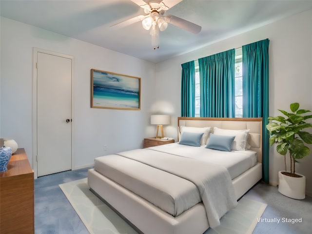 bedroom with ceiling fan and wood-type flooring