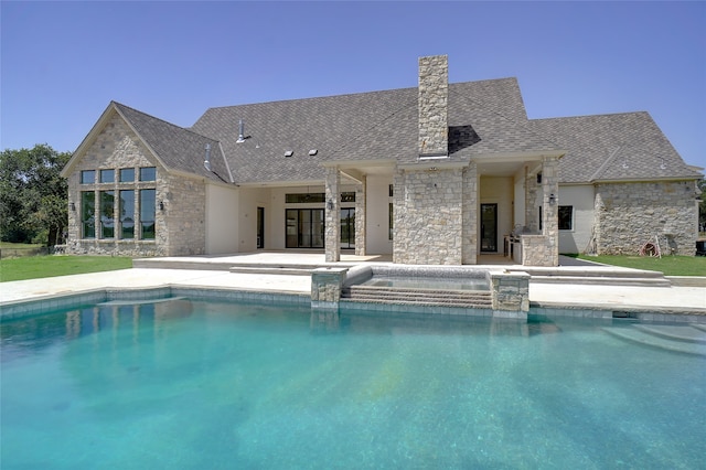 view of swimming pool featuring ceiling fan and a patio area