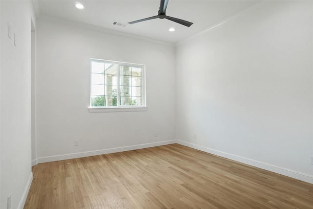 empty room featuring ceiling fan, ornamental molding, and light hardwood / wood-style floors