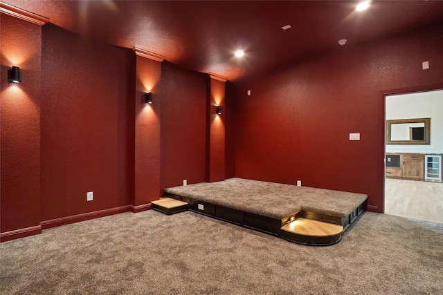 home theater with crown molding and carpet flooring