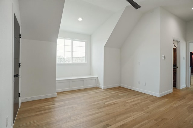 bonus room with lofted ceiling and light hardwood / wood-style flooring