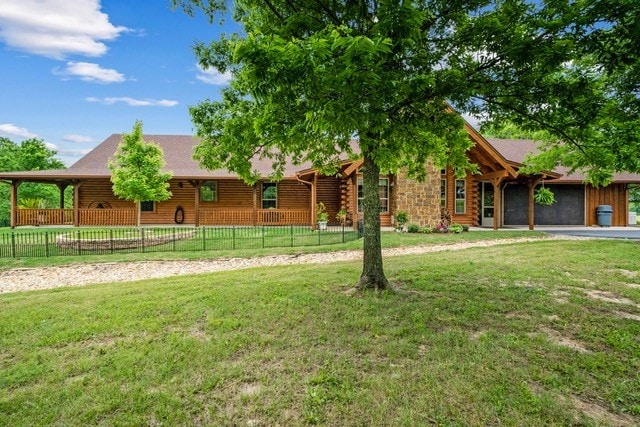 log home featuring a front yard