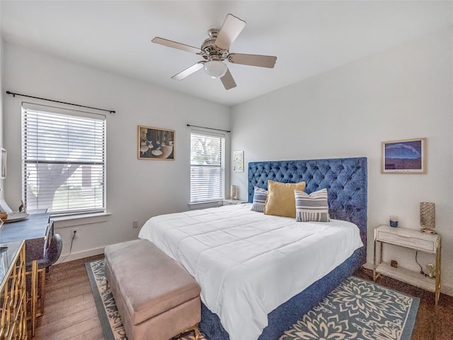 bedroom with dark wood-type flooring and ceiling fan