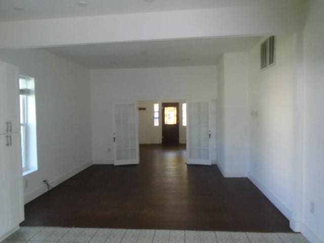 empty room with hardwood / wood-style flooring