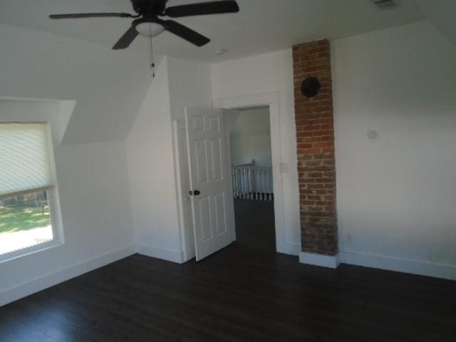 additional living space featuring dark hardwood / wood-style floors and ceiling fan