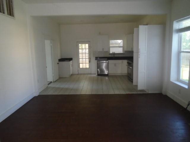 interior space with sink, a wealth of natural light, and light hardwood / wood-style floors