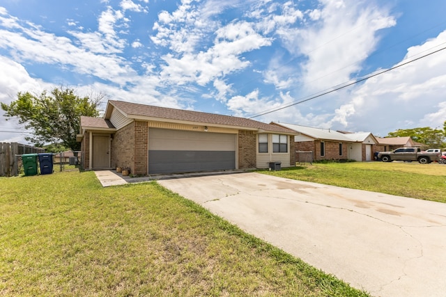 ranch-style house featuring a garage and a front lawn