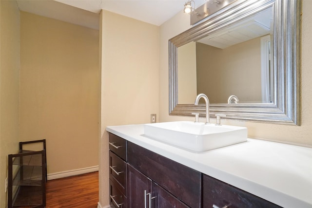 bathroom featuring vanity and wood-type flooring