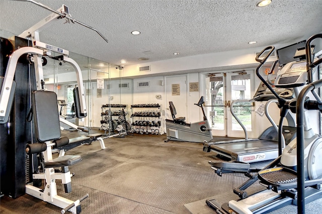 workout area with a textured ceiling