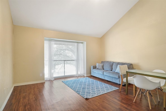 sitting room featuring hardwood / wood-style flooring and vaulted ceiling