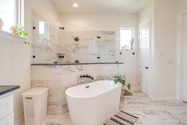 bathroom featuring shower with separate bathtub, vanity, and plenty of natural light