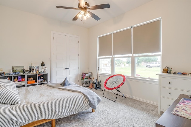 bedroom with ceiling fan and light colored carpet