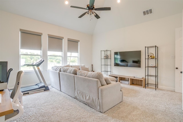 carpeted living room featuring high vaulted ceiling and ceiling fan