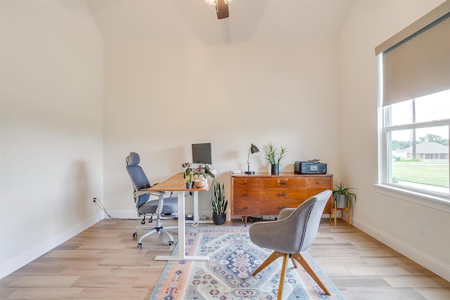 office space featuring vaulted ceiling, light hardwood / wood-style floors, and ceiling fan