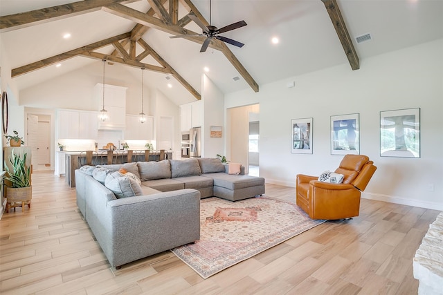 living room featuring high vaulted ceiling, light wood-type flooring, beam ceiling, and ceiling fan