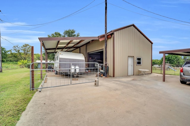 view of outdoor structure featuring a yard and a garage