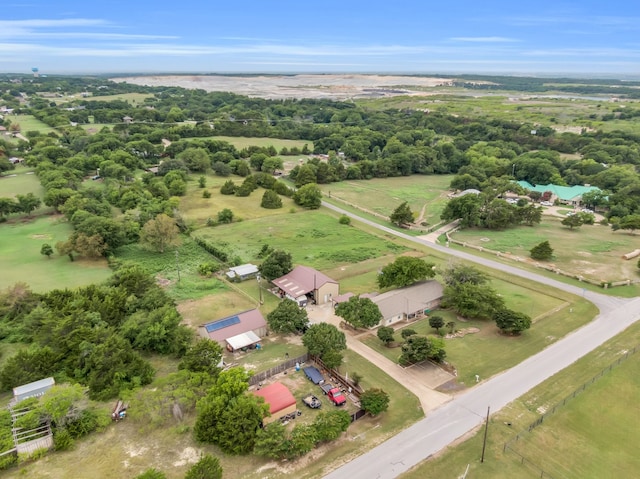 birds eye view of property with a rural view