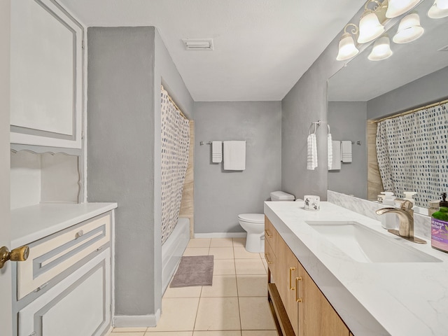 bathroom with tile patterned floors, vanity, and toilet