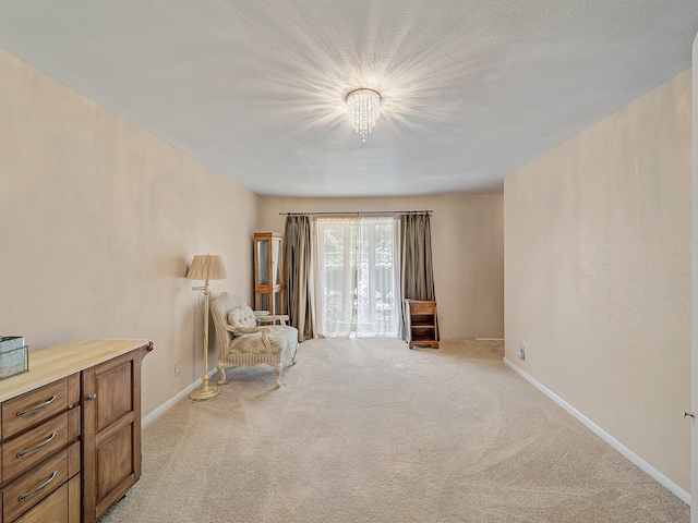 living area featuring light colored carpet