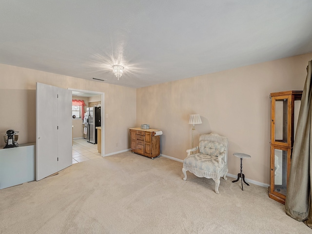 living area with light colored carpet